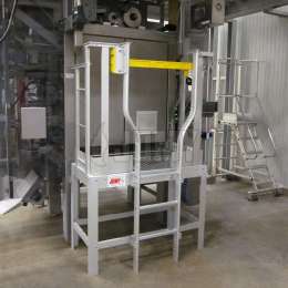 Ladder and platform for machine maintenance Industrial ladder and platform with safety swing door for machine maintenance and operation.
